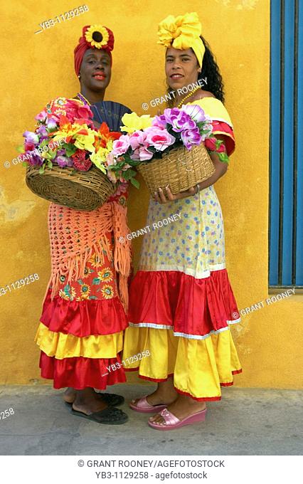 Two Cuban women in traditional dress, Plaza de la Catedral, Habana, Cuba