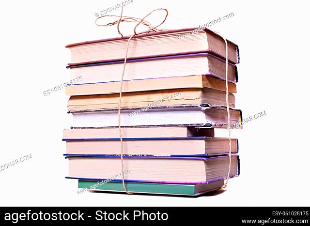 Old books tied up by cord isolated