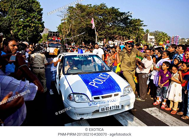 Police car at traditional procession in a carnival, Goa Carnivals, Goa, India