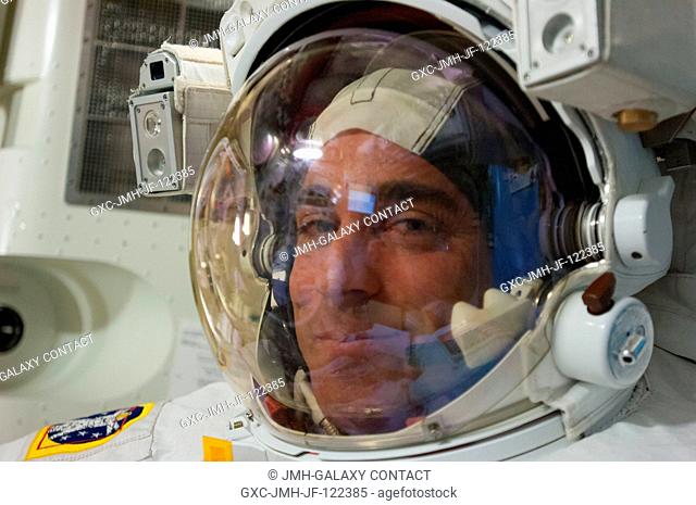 Expedition 35 Flight Engineer Chris Cassidy is captured in a close-up image in the Quest Airlock of the International Space Station prior to a space walk which...