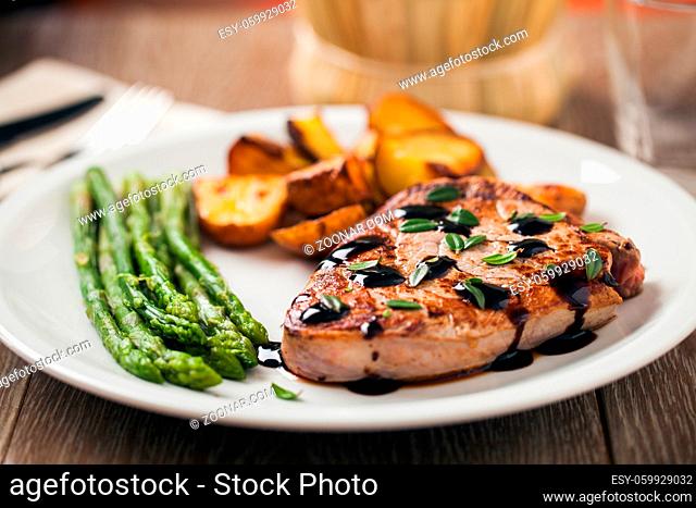 Fillet of beef with potatoes and asparagus on a plate