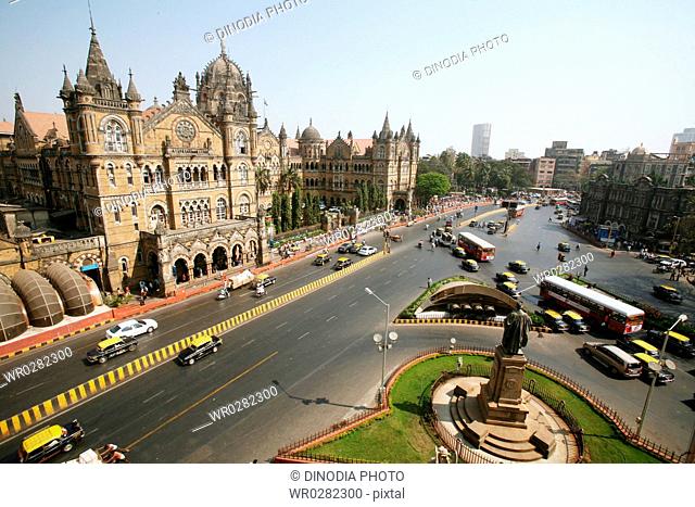 Traffic outside of Victoria Terminus VT now Chhatrapati Shivaji Terminus CST in Bombay Mumbai , Maharashtra , India UNESCO World Heritage