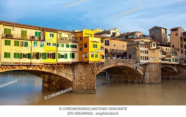 Side view at sunset of Ponte Vecchio in Florence, Italy