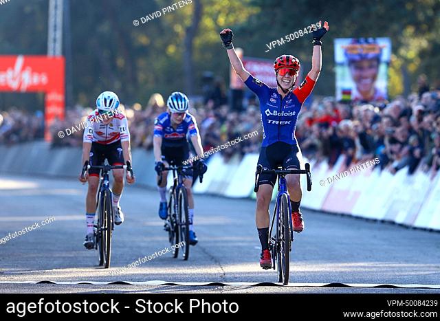 Dutch Shirin van Anrooij celebrates as she crosses the finish line to win the women elite race at the UCI Cyclocross World Cup cyclocross event in Beekse Bergen