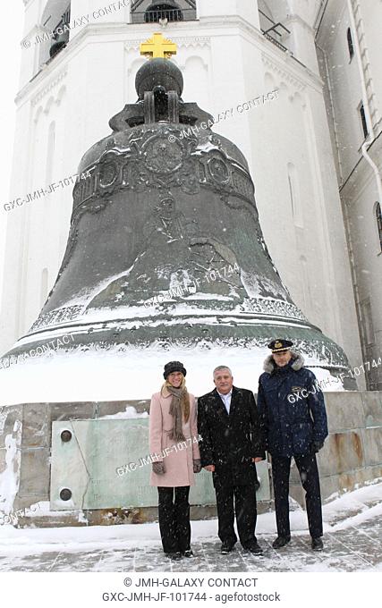 The Expedition 34 backup crew members pose for pictures in front of the Tsar Bell at the Kremlin in Moscow Nov. 29, 2012 during ceremonial activities that...