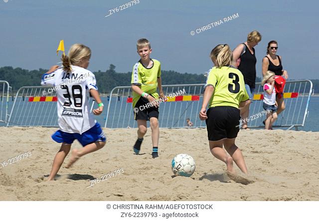Players in mixed gender and age in the Family game series. Ahus Beach Soccer tournament 2014