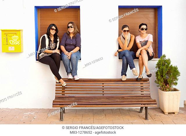 Girls posing in bench, Popular festivities in Carricola, Valencia