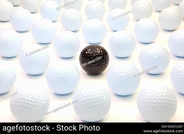 Pattern with white and black golf balls on the table