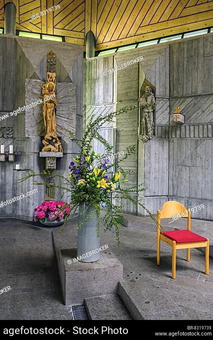 Statues of saints and floral decorations, St. Hedwig, Roman Catholic parish church in the Thingers district, Kempten, Allgäu, Bavaria, Germany, Europe