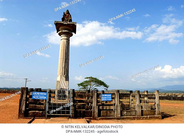 Kshetrapala sitting on Bramha Yaksha Manstambha erected in 1436 ; height 25 feet is situated on Gommata Betta at Karkala ; District Udupi ; Karnataka ; India