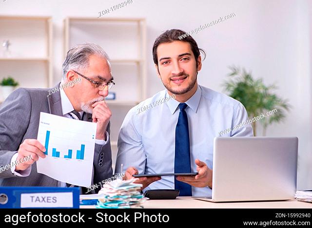 The two accountants working in the office