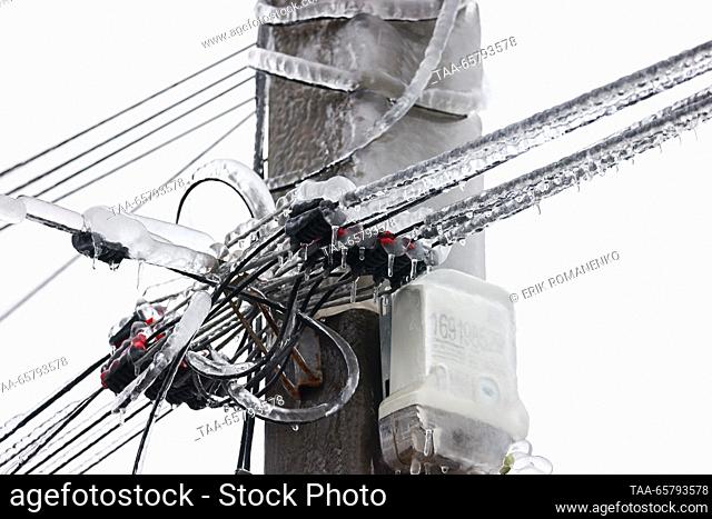 RUSSIA, ROSTOV REGION - DECEMBER 15, 2023: Ice-covered wires of a power transmission line are pictured after freezing rain in the village of Krasny Krym