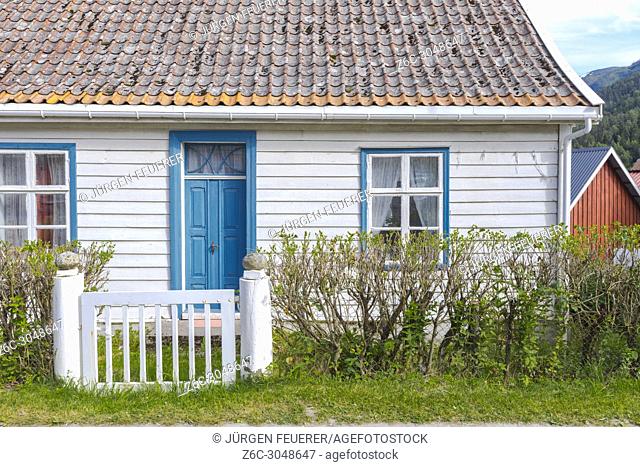 white wooden house in the village Solvorn, Norway, Norwegian house with garden gate