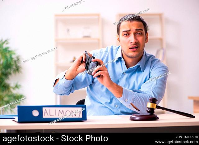 Young man in the courthouse in divorcing concept