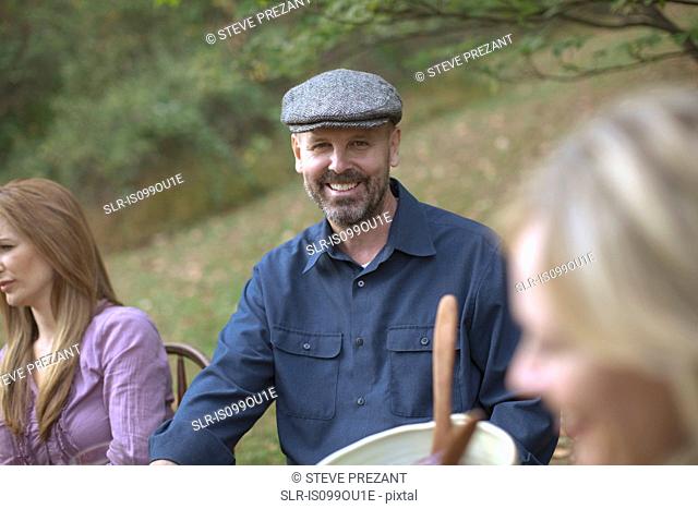 Mature man at outdoor dinner