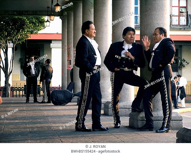 Mariachis killing idle time waiting for a job in Plaza Garibaldi, Mexico DF, Mejico, Mexico
