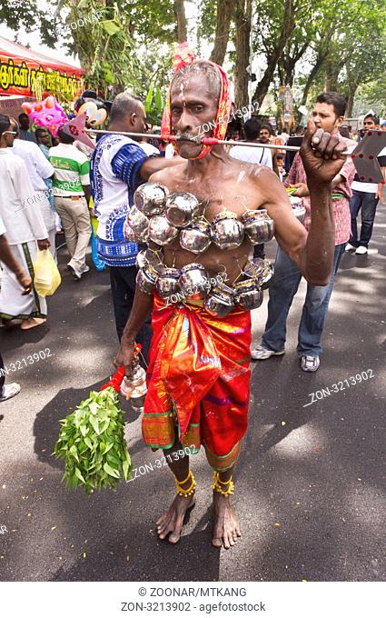 Thaipusam festival, body piercing is conducted by devotees, Penang, Malaysia 2011
