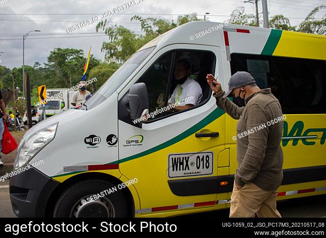 Truckers and demonstrators give way to vehicles on the blockade as National truckers strike at Dosquebradas- Santa Rosa de Cabal traffic circle Risaralda