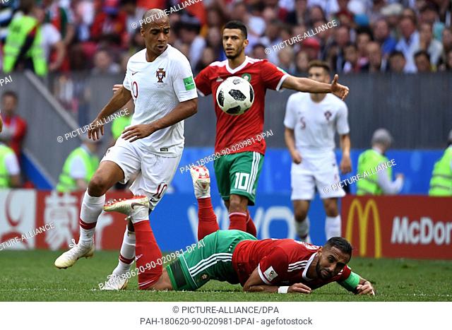 20 June 2018, Russia, Moscow: Soccer, World Cup, Portugal vs Morocco, group B preliminary, at the Luzhniki Stadium. Portugal's Joao Mario (l) and Morocco's...