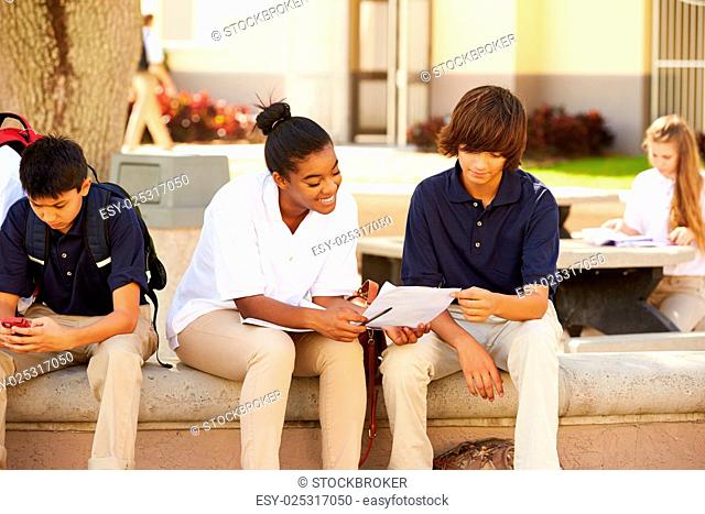 High School Students Hanging Out On School Campus