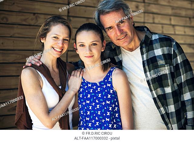 Portrait of family standing outdoors