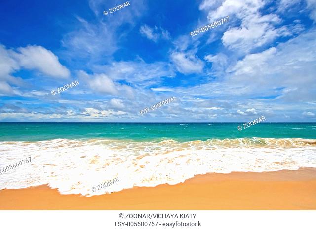 Ripple on White Sand Beach with Perfect Sunny Sky at Phuket Thailand