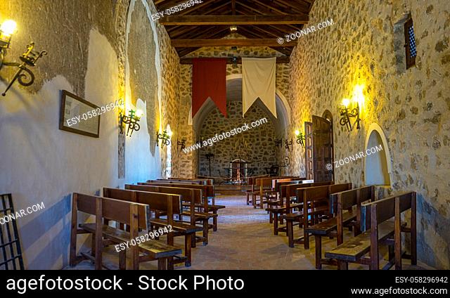 wooden seats, Interior of a medieval castle in Toledo, Spain. Stone rooms with wooden furniture, medieval period of the Spanish reign