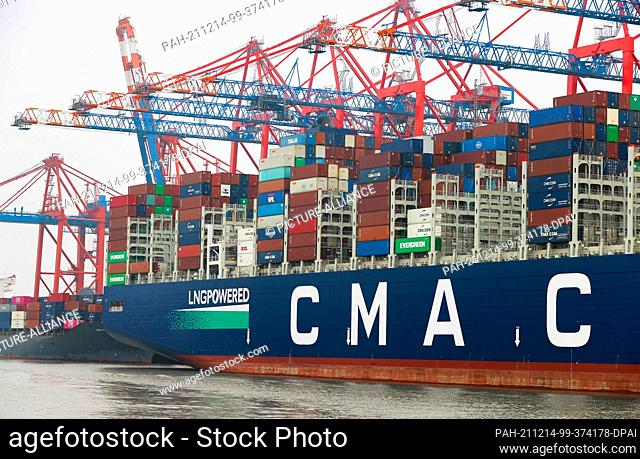 09 December 2021, Hamburg: The container ship CMA CGM Sorbonne of the shipping company CMA CMG is moored at the container terminal Eurogate in Waltershofer...