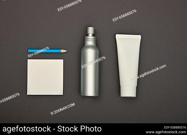 Close up flat lay of men grooming, hygiene or beauty care products over grey background, elevated top view, directly above