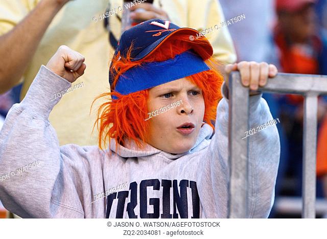 Oct 15, 2011; Charlottesville VA, USA; A Virginia Cavaliers fan cheers in the stands against the Georgia Tech Yellow Jackets during the third quarter at Scott...