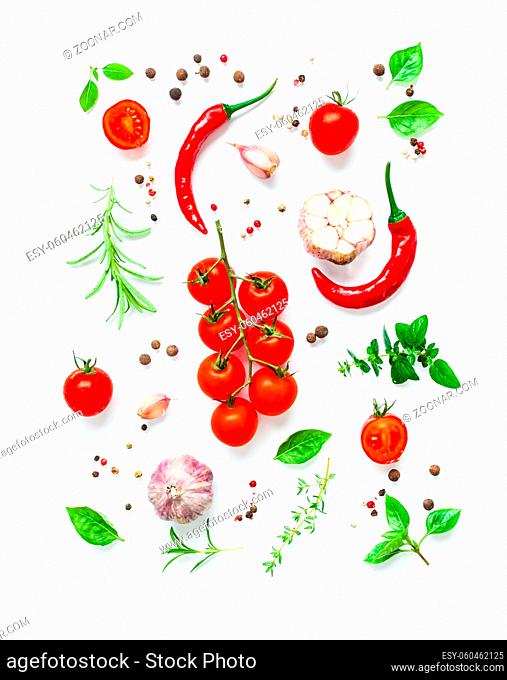 Tomatoes and various herbs and spices isolated on white background, top view of food art. Food design in italian restaurant