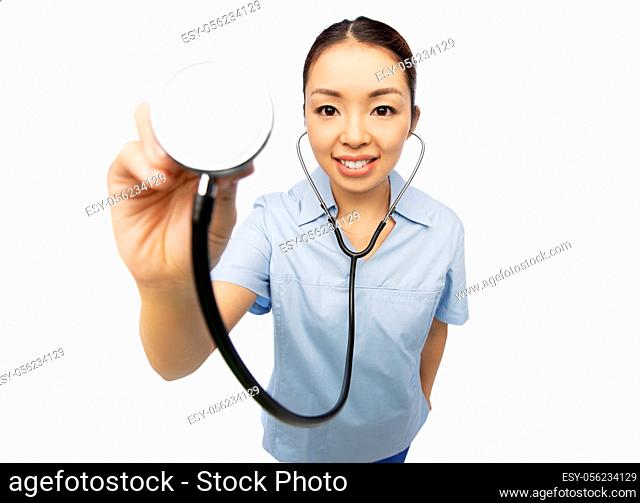 happy smiling asian female doctor with stethoscope