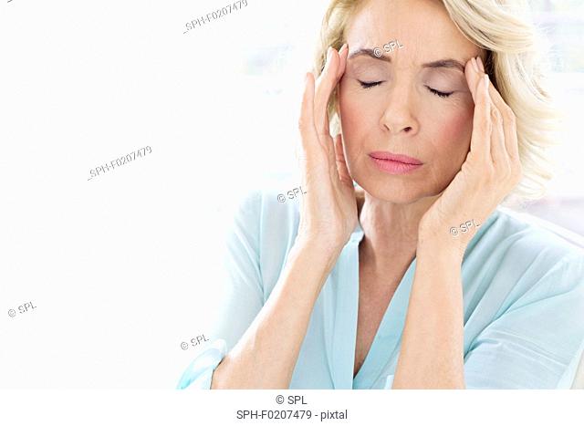 Mature woman with headache