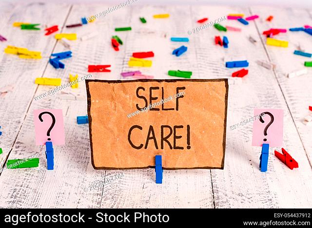 Conceptual hand writing showing Self Care. Concept meaning practice of taking action to preserve or improve ones own health Crumbling sheet with paper clips...