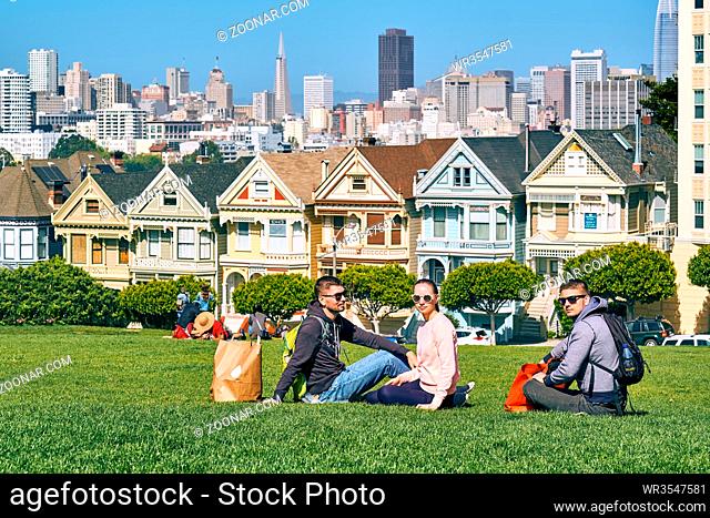 Young people in park at Alamo Square in San Francisco, California, USA