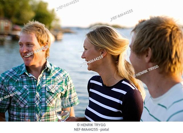 Three happy people Fejan Stockholm archipelago Sweden