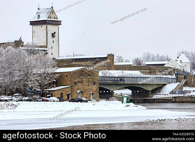 RUSSIA, LENINGRAD REGION - DECEMBER 7, 2023: A view of the Narva Fortress (Hermann Castle) from the Ivangorod crossing point on the Russian-Estonian border