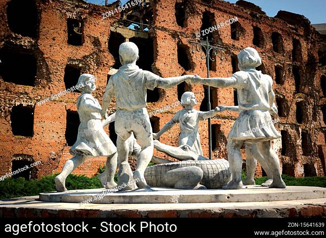 Volgograd/Russia-18.06.2016:The statue of with circle of kids and crocodile and destroyed building