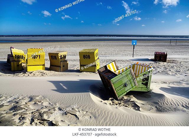 Beach chairs on the beach after a stormy night, Langeoog Island, North Sea, East Frisian Islands, East Frisia, Lower Saxony, Germany, Europe