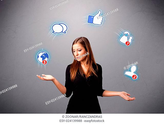 attractive young woman juggling with social network icons