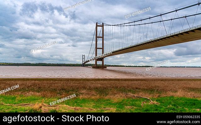Grey clouds over the Humber Bridge, seen from Barton-Upon-Humber in North Lincolnshire, England, UK