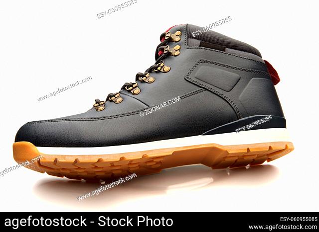Close up view of a modern black man boot isolated on a white background