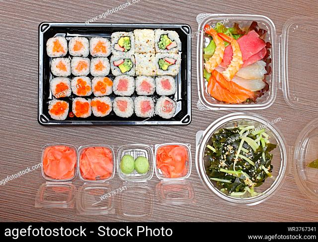 Raw Fish Slices Sashimi and Sushi Algae Salad Japanese Takeaway
