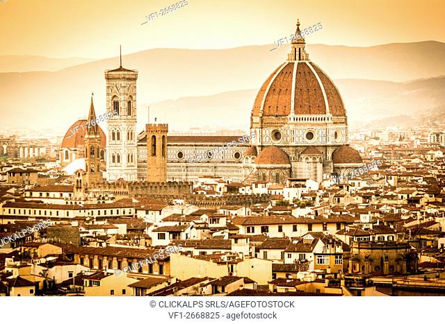 Florence, Tuscany, Italy. cityscape and Cathedral and Brunelleschi Dome, Giotto Tower. Sunset, lights on