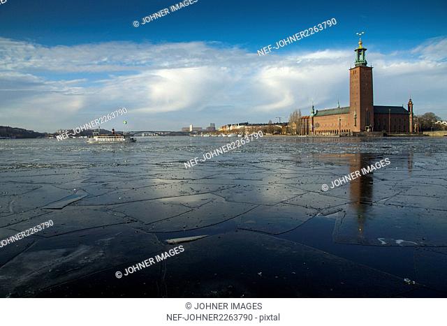Ice on sea, Stockholm City Hall on background, Sweden