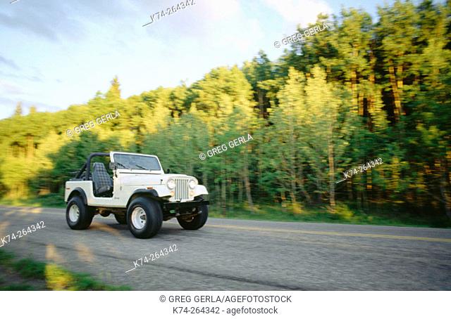 Jeep CJ7 on highway in Foothills County. Canada