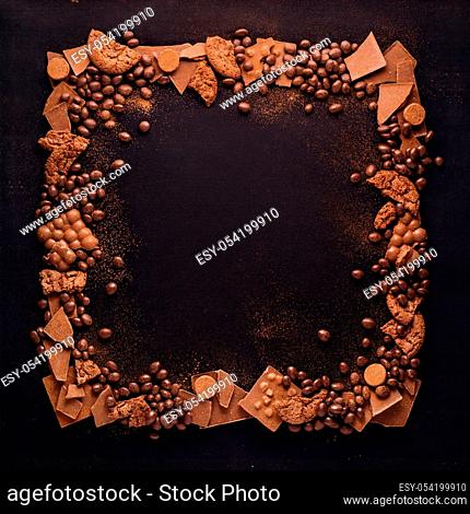Creative concept photo of frame made of chocolate on black background