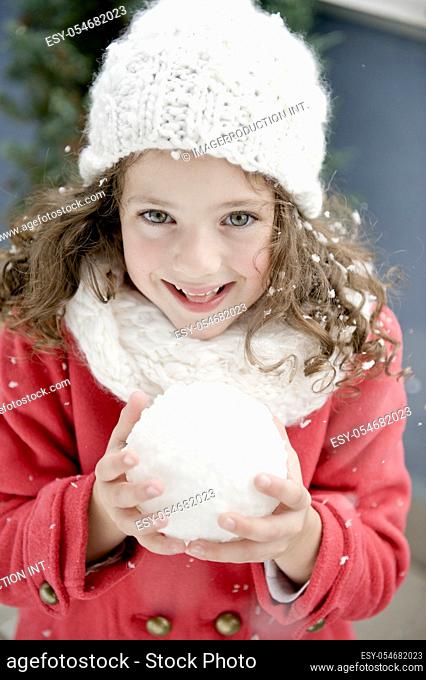 Czech Republic, Pretty girl (4-5) with snowball