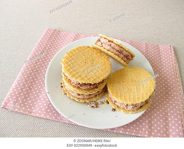 Round wafers with chocolate ice cream filling