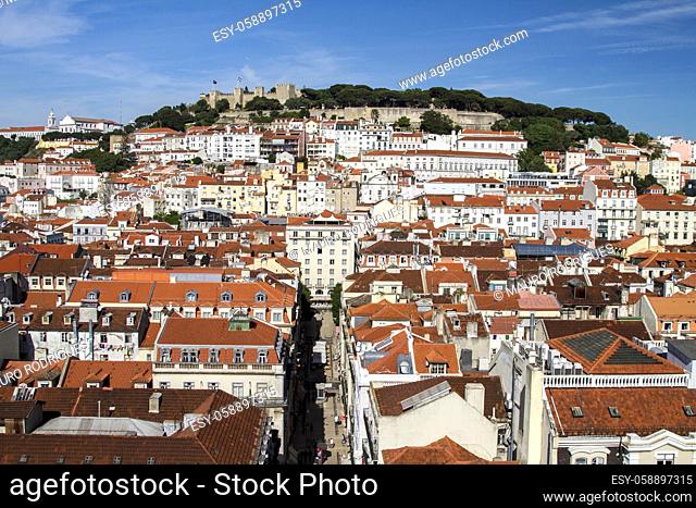 View of the beautiful Lisbon downtown area with landmark castle of Sao Jorge on top of the hill
